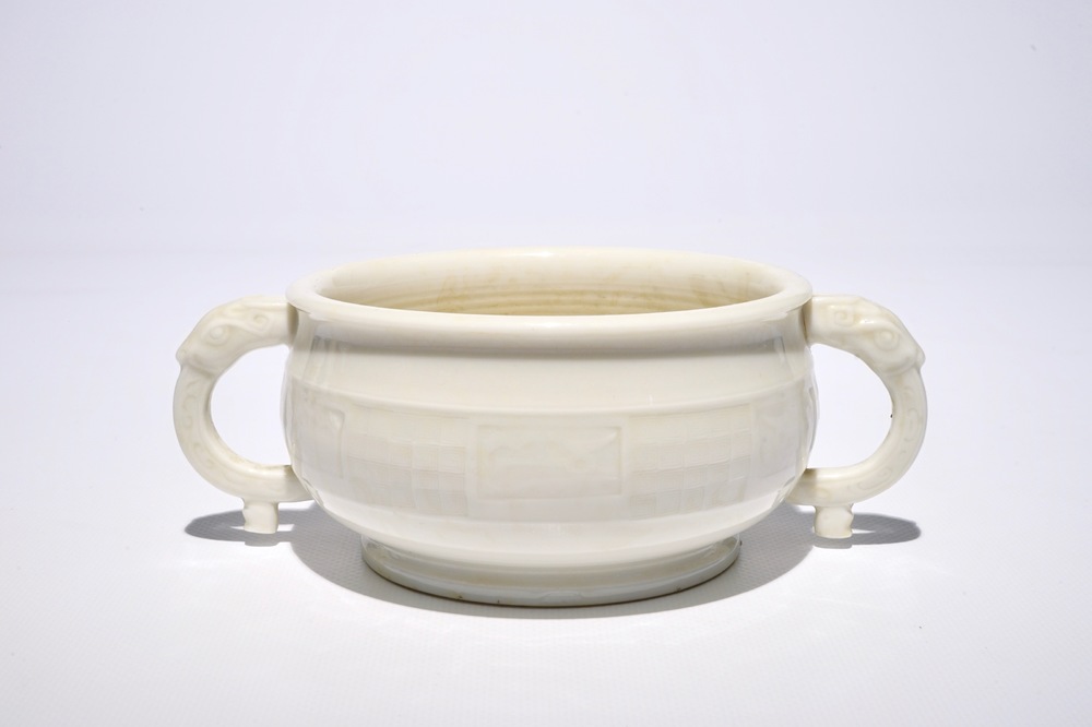 A round Chinese Dehua blanc de Chine censer with moulded and underglaze decoration, 19th C.