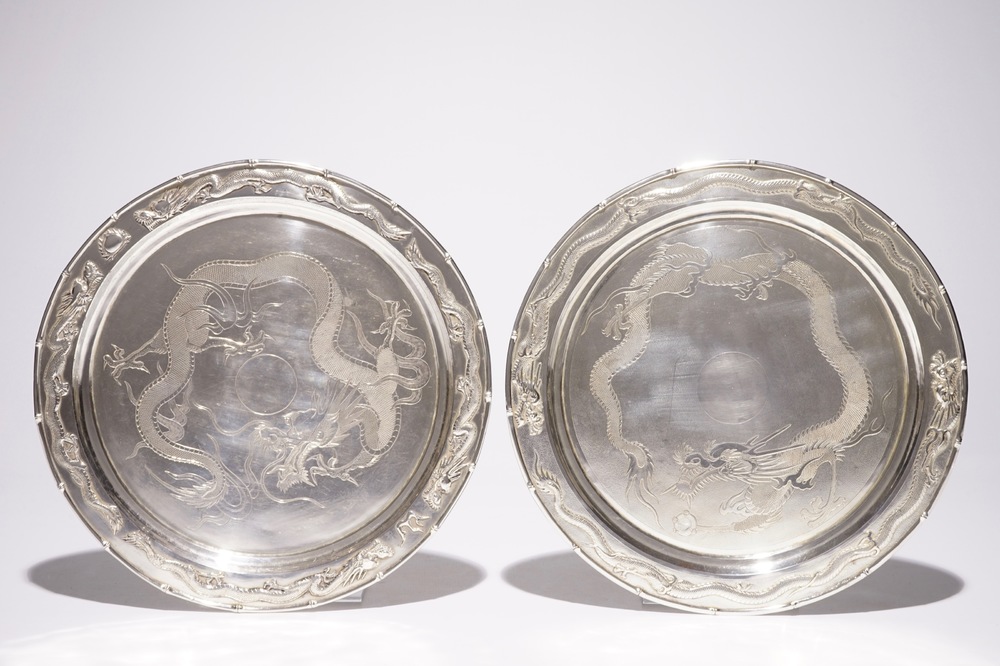 A pair of Chinese silver &quot;dragon&quot; plates, 19/20th C.