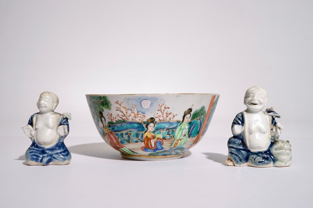 Two Chinese blue and white glazed biscuit figures of boys, Qianlong, and a Canton famille rose bowl, 19th C.