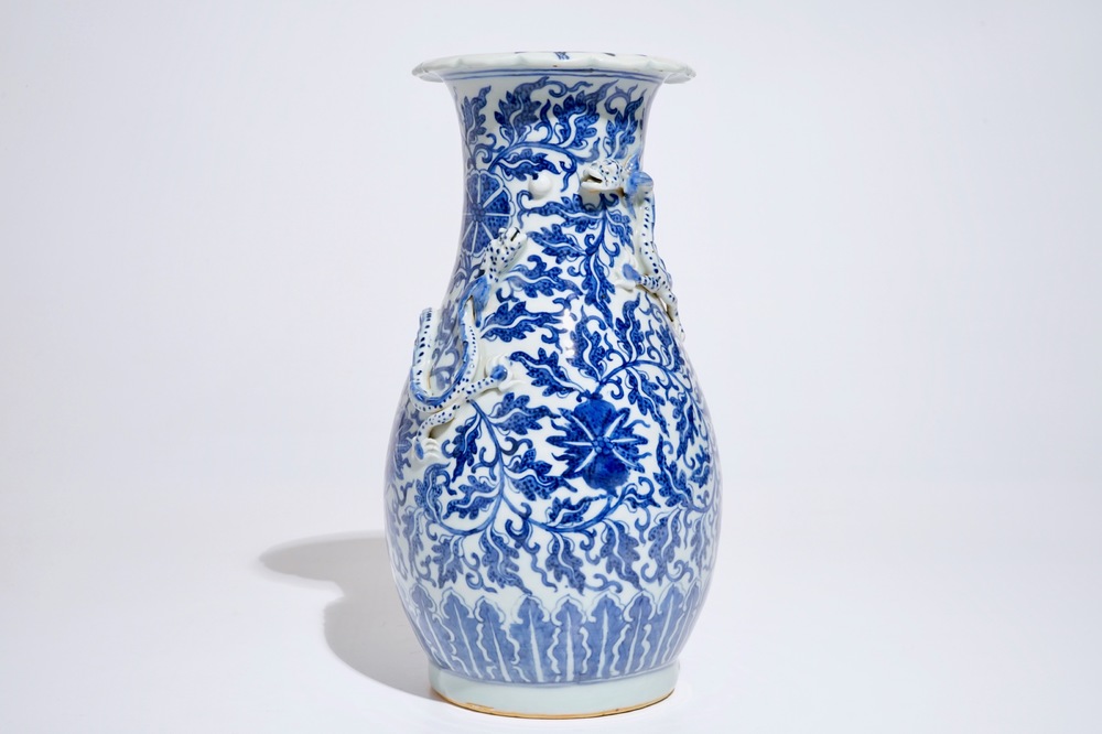 A Chinese blue and white lotus scroll vase, 19th C.