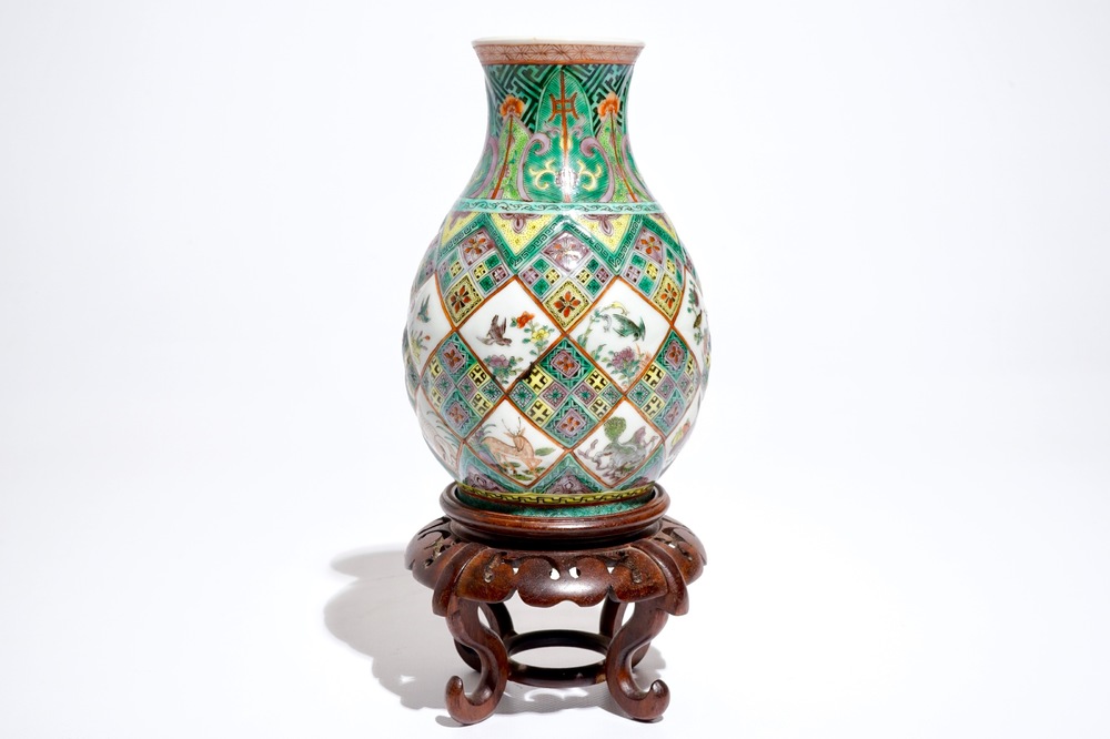 A Chinese famille verte vase with exotic animals, 19th C.