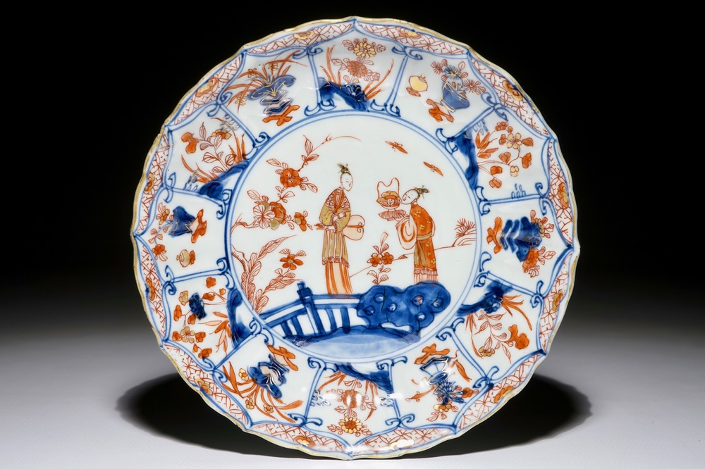 A Chinese Imari style plate with ladies in a garden, Kangxi