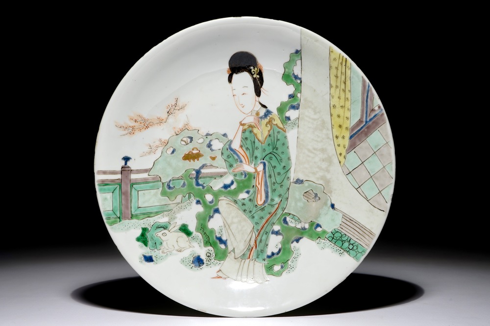 A Chinese famille verte plate with a lady in the garden, Kangxi mark and period