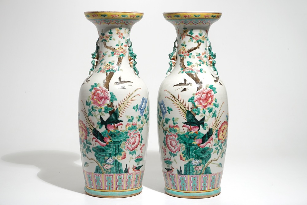A pair of Chinese famille rose vases with pheasants and peacocks, 19th C.