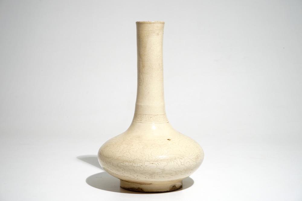 A Chinese cream-glazed bottle vase with anhua design, Song/Ming