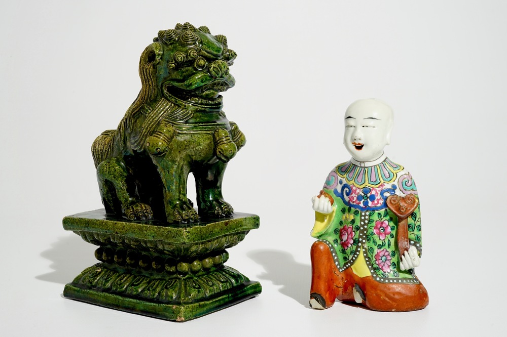 A Chinese famille rose kneeling boy and a green-glazed Ming-style temple lion, 19th C.