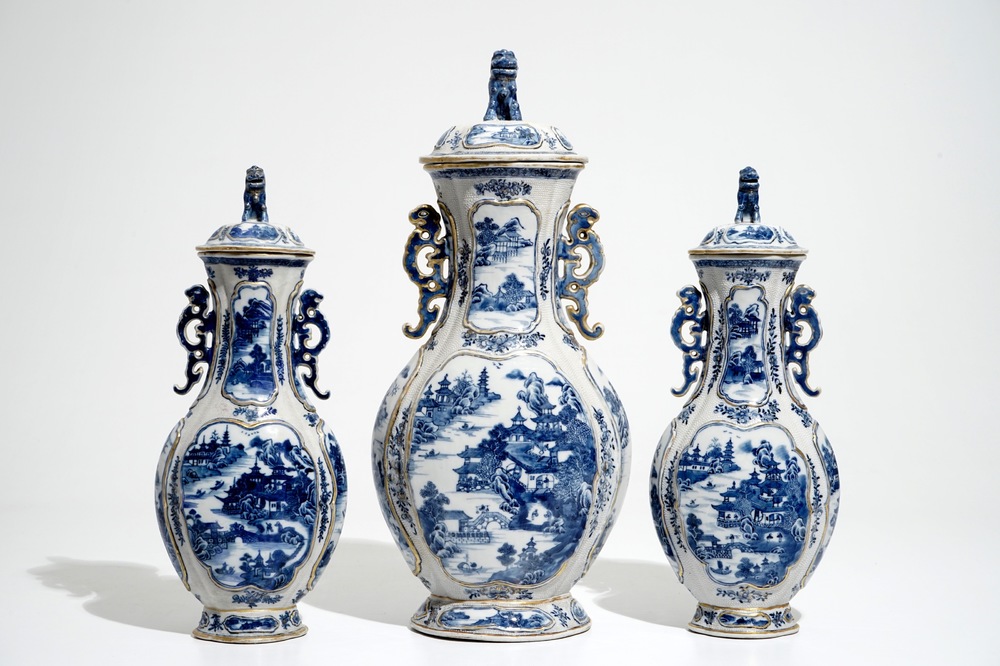 A garniture of three Chinese blue and white covered vases with landscape design, Qianlong