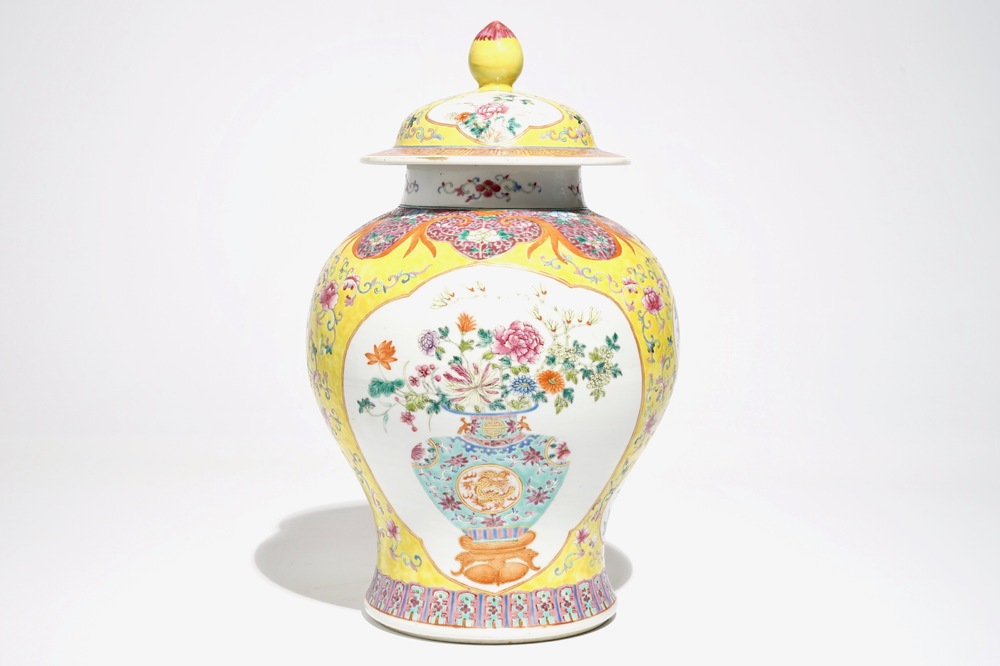 A Chinese famille rose baluster vase and cover with design of a flowervase, 19th C.