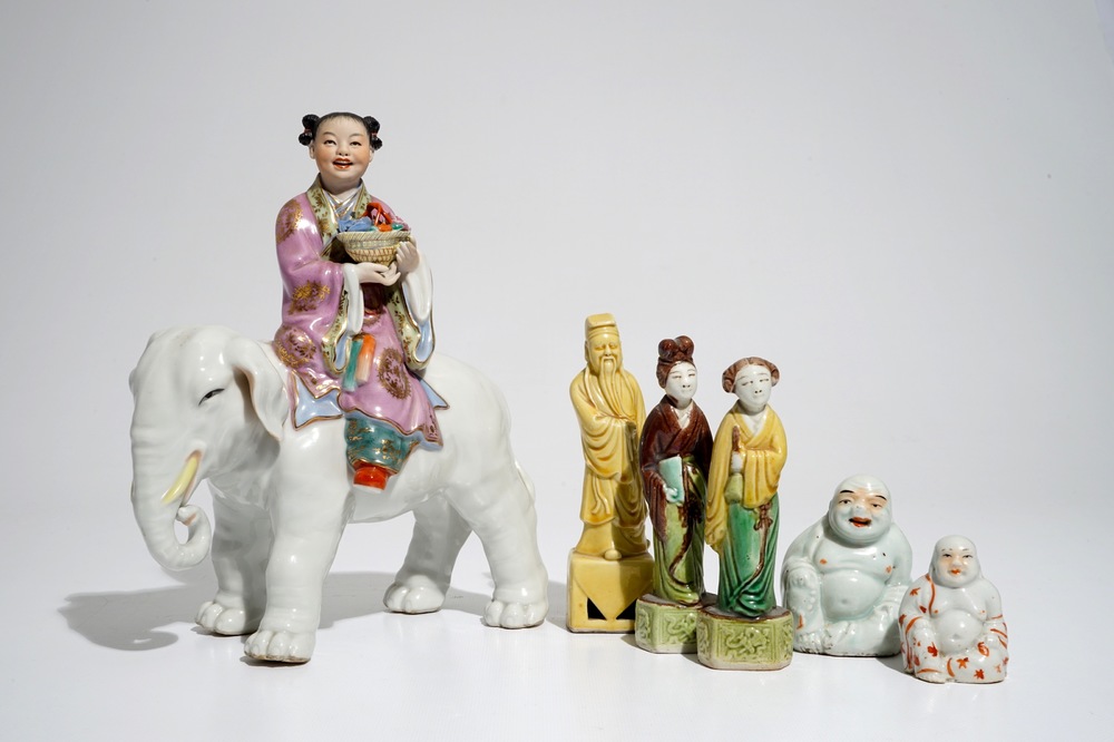 Six various Chinese famille rose and sancai-glazed figures, incl. a girl on an elephant, 19/20th C.