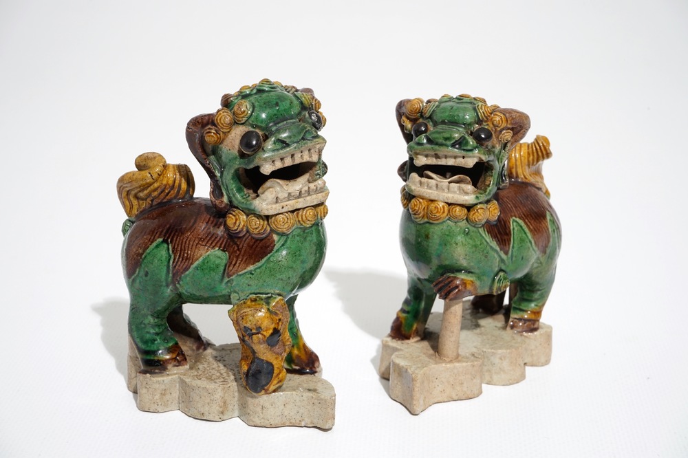 A pair of Chinese verte biscuit models of Buddhist lions, Kangxi