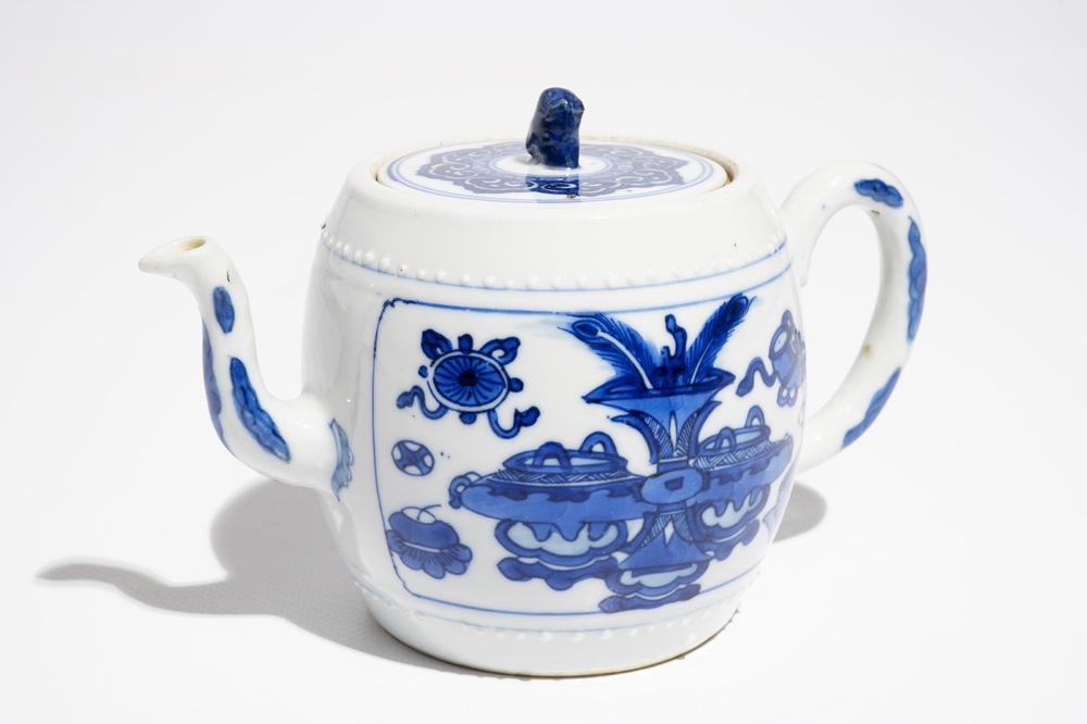 A Chinese blue and white teapot and cover with antiquities, Kangxi