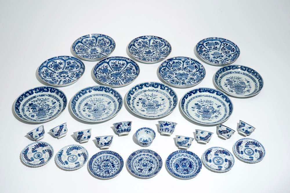 Eleven Chinese blue and white plates, eleven cups and seven saucers, Kangxi and later