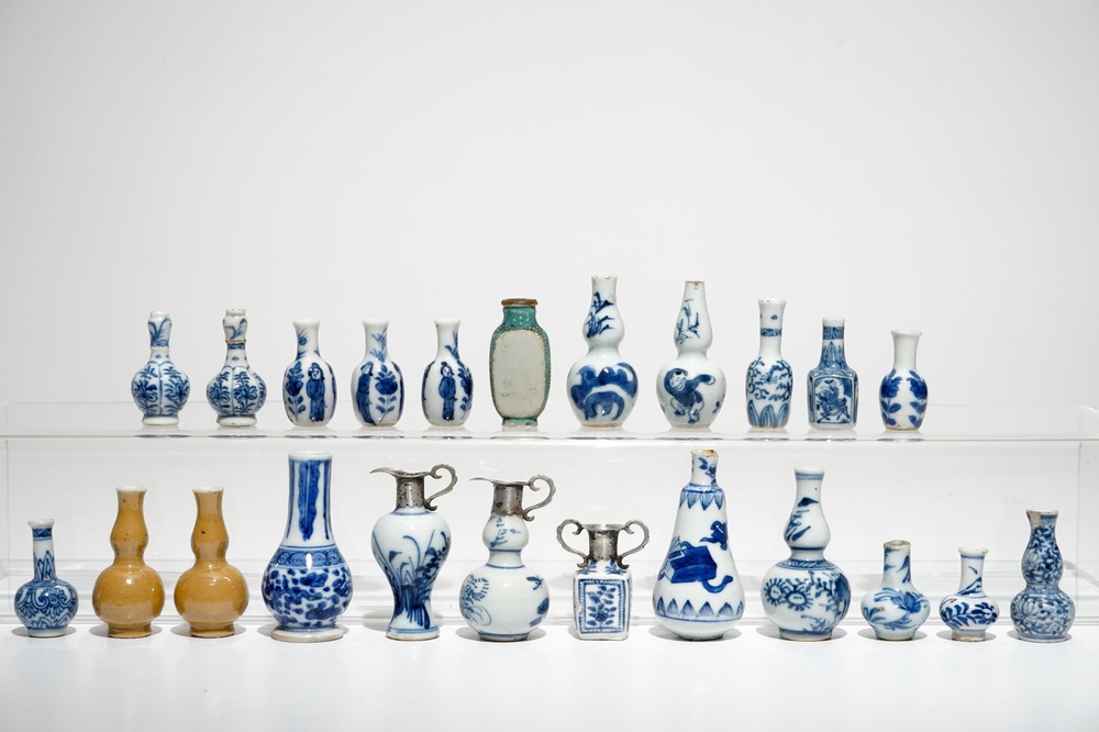 A collection of twenty-three Chinese miniature dolls house vases, mostly Kangxi