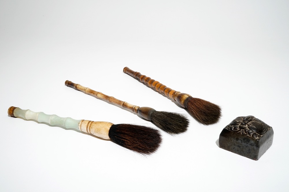 A Chinese stone stamp and three Chinese calligraphy brushes of bamboo, jade and horn, 19/20th C.