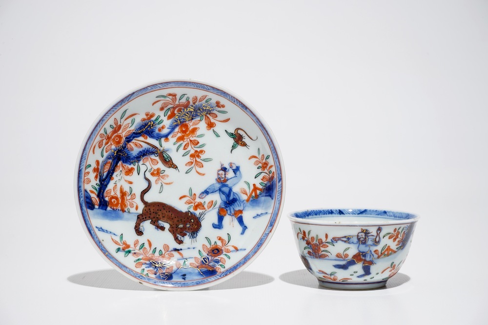A Chinese Dutch-decorated Amsterdams bont cup and saucer with a tiger, Kangxi/Qianlong