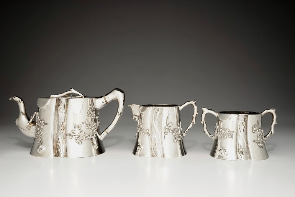 A Chinese silver teapot, milk jug and sugar bowl, Luen Wo, 1880-1940