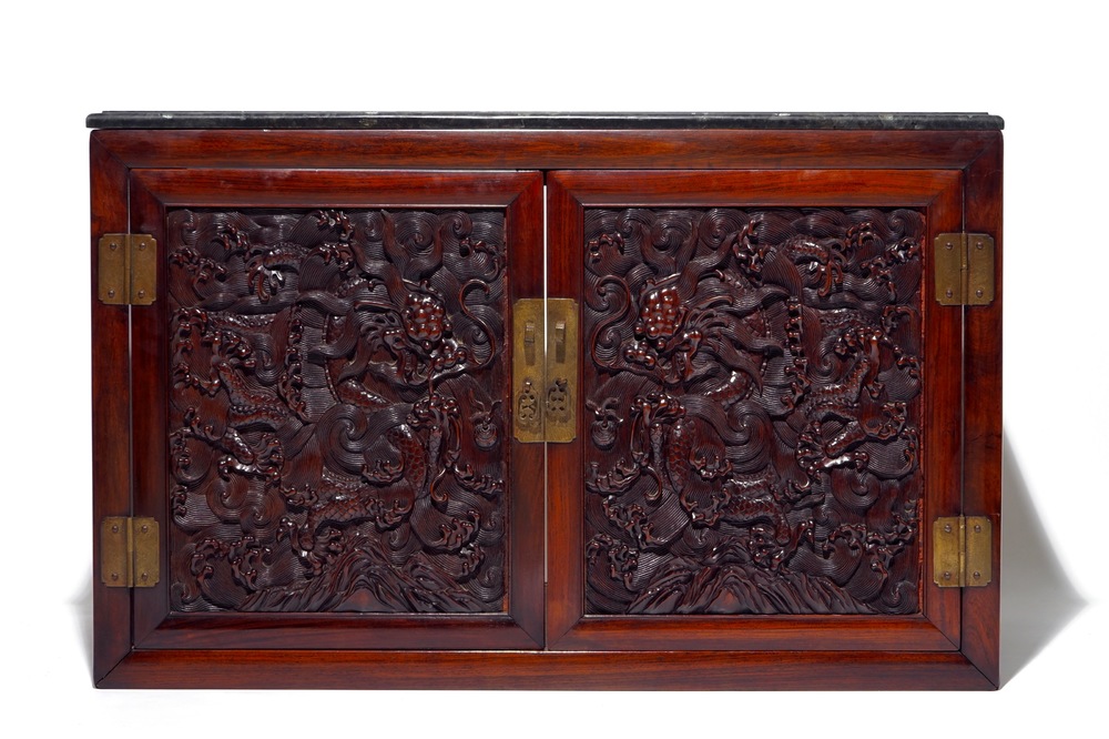 A Chinese two doors cabinet in hongmu and huanghuali with zitan dragon panels, 18/19th C.