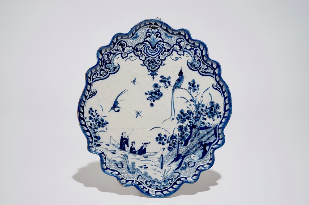 A Dutch Delft blue and white chinoiserie plaque with figures in a boat, 1st half 18th C.