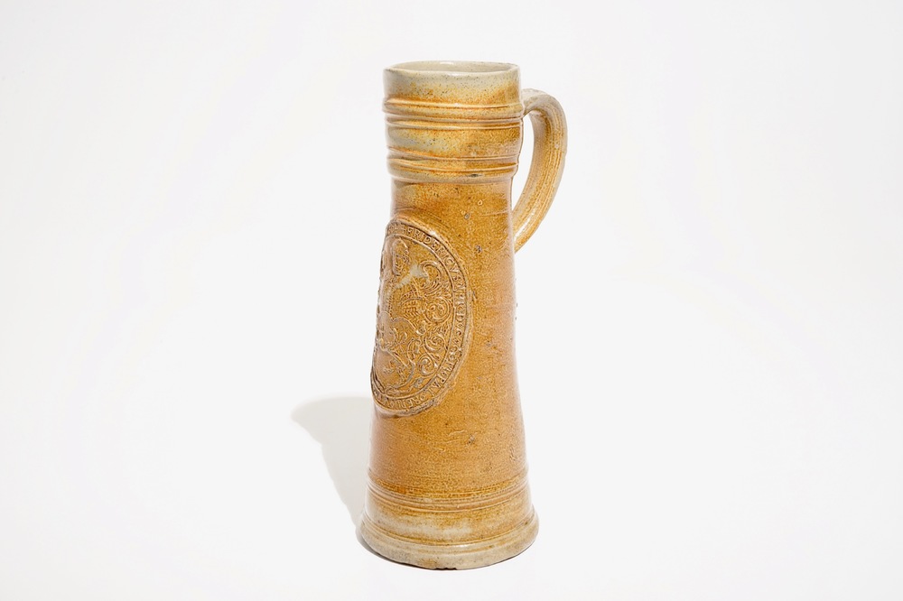 A large Raeren stoneware schnelle type mug with the arms of Frederick IV, dated 1604