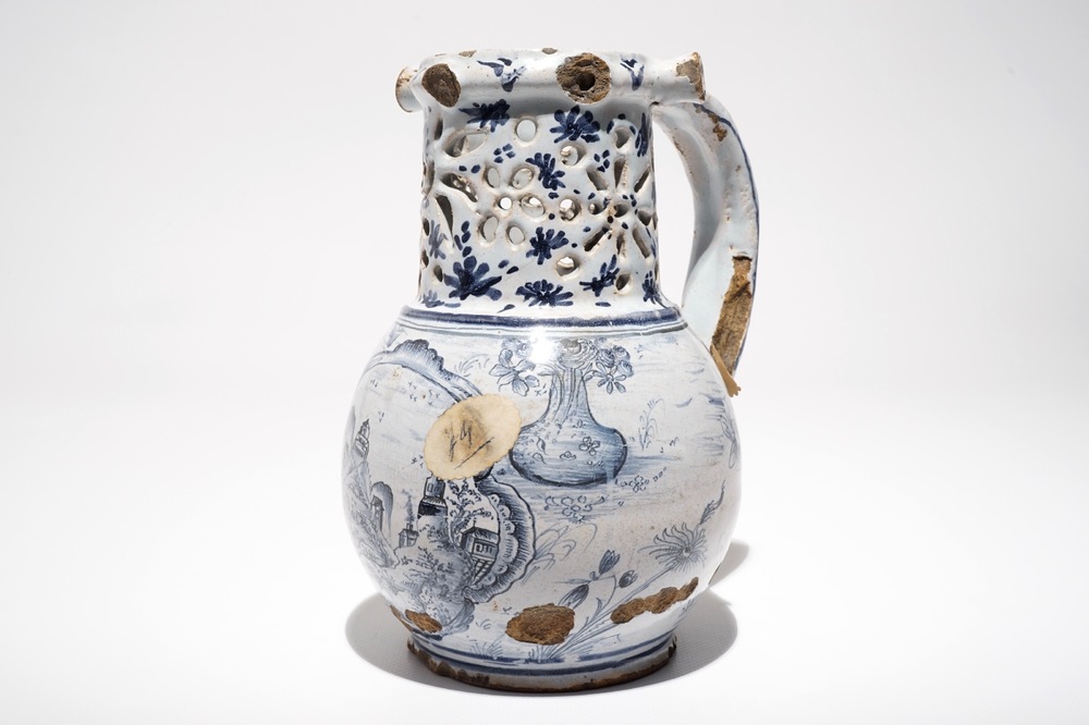 A French faience blue and white puzzle jug, poss. Lille, 18th C.