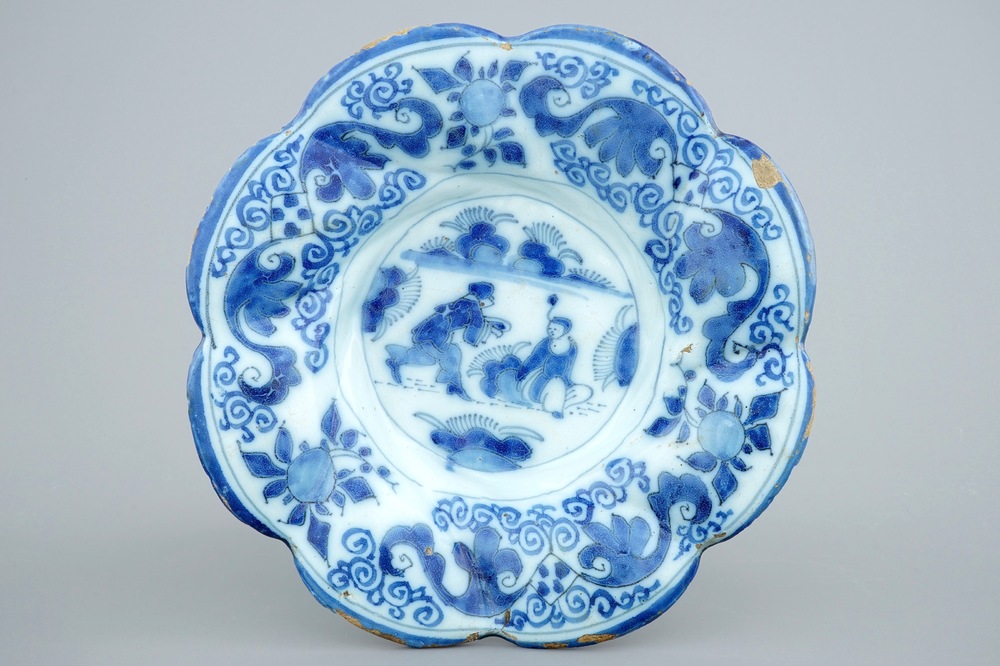 A Dutch Delft blue and white gadrooned chinoiserie dish, 2nd half 17th C.