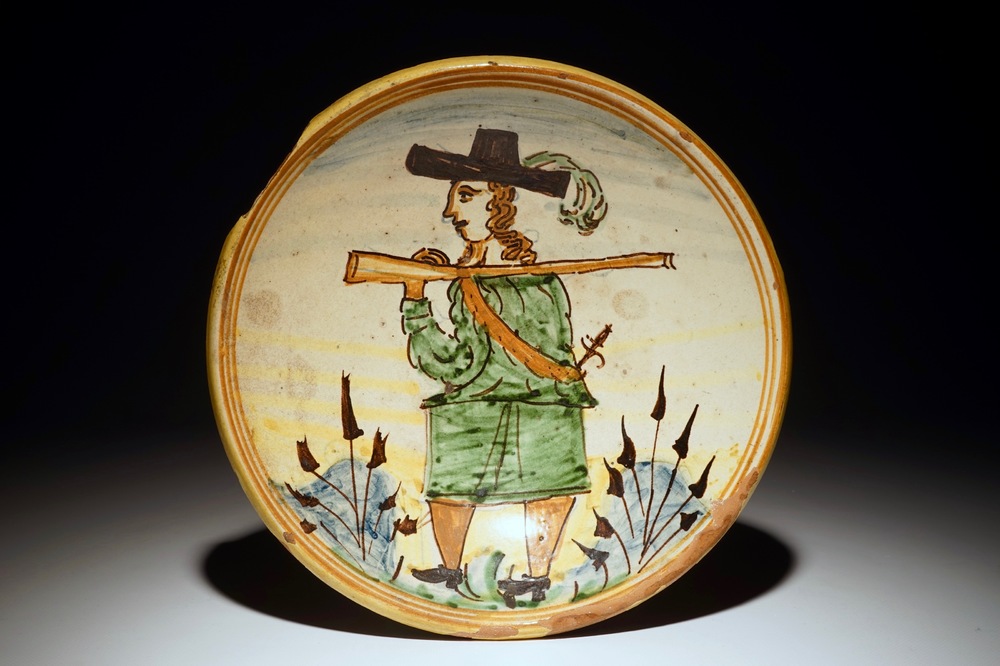 A polychrome Italian maiolica dish with a soldier, prob. Montelupo, 17/18th C.
