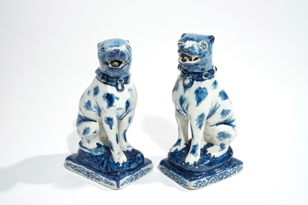 A pair of Dutch Delft blue and white models of dogs, 1st half 18th C.