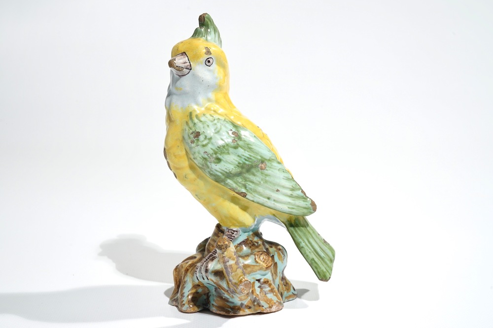 A polychrome Dutch Delft or French faience model of a bird, 18/19th C.