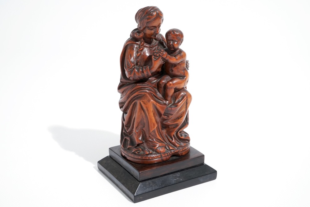 A carved boxwood Madonna with child, 17th C.