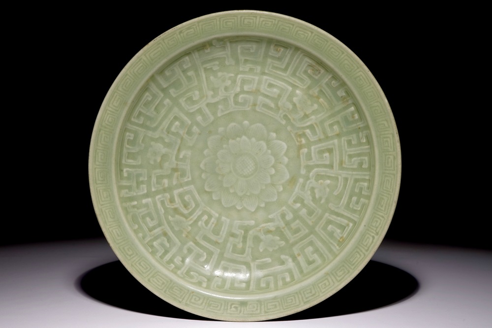 A Chinese celadon dish with incised lotus design, 18/19th C.