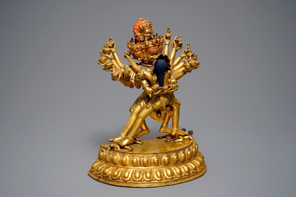 A large Sino-Tibetan gilt bronze figure of Kapaladhara Hevajra, 17/18th C.