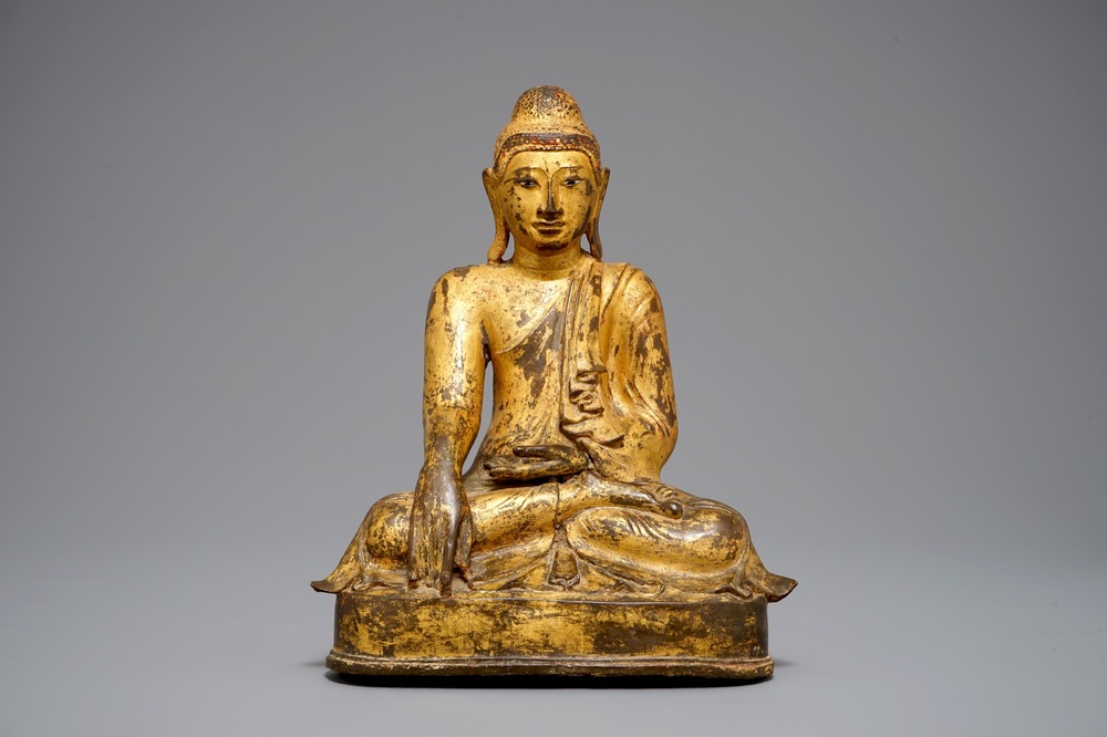 A large Burmese inlaid, gilt and lacquered bronze Mandalay-style Buddha, 19th C.