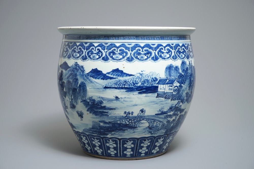 A Chinese blue and white fish bowl with a river landscape, 19th C.