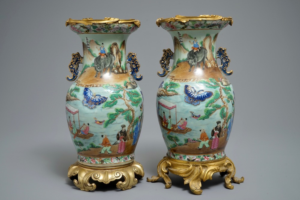 Une paire de vases aux montures en bronze ormolu en porcelaine de Chine famille rose sur fond c&eacute;ladon, 19&egrave;me