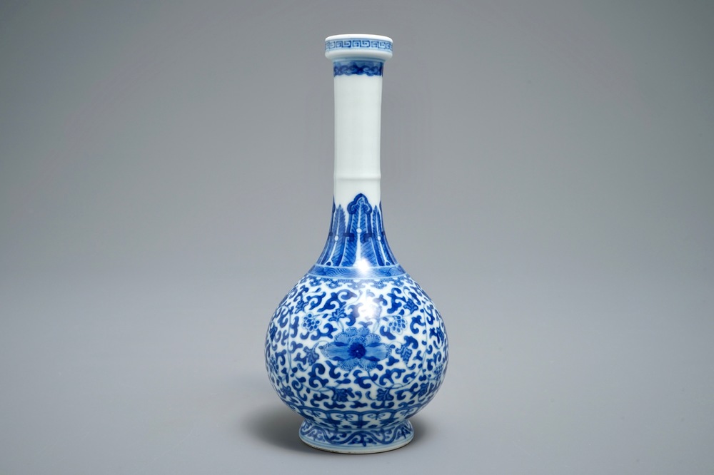 A Chinese blue and white bottle vase with floral design, Yongzheng 