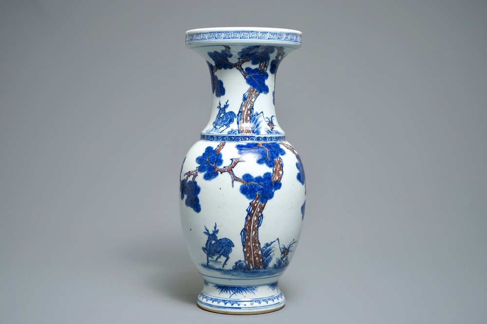 A Chinese blue, white and iron red vase with deer, 19/20th C.