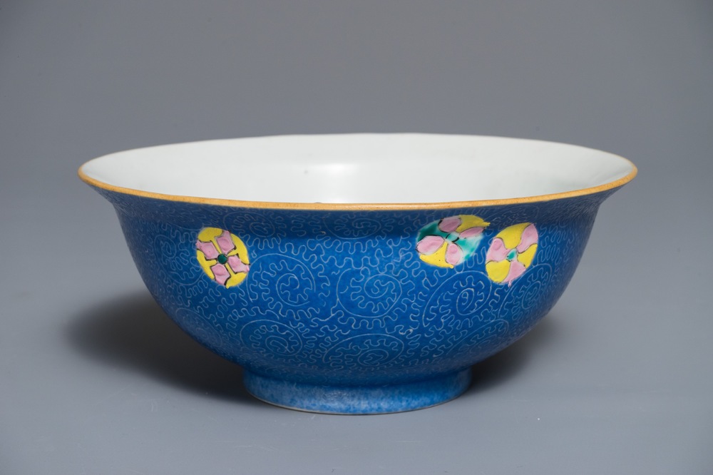 A Chinese famille rose blue ground sgraffiato bowl, Qianlong mark, 19th C.