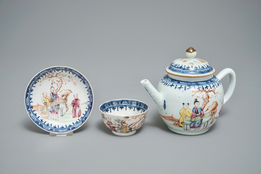 A Chinese famille rose mandarin teapot with cup and saucer, Qianlong