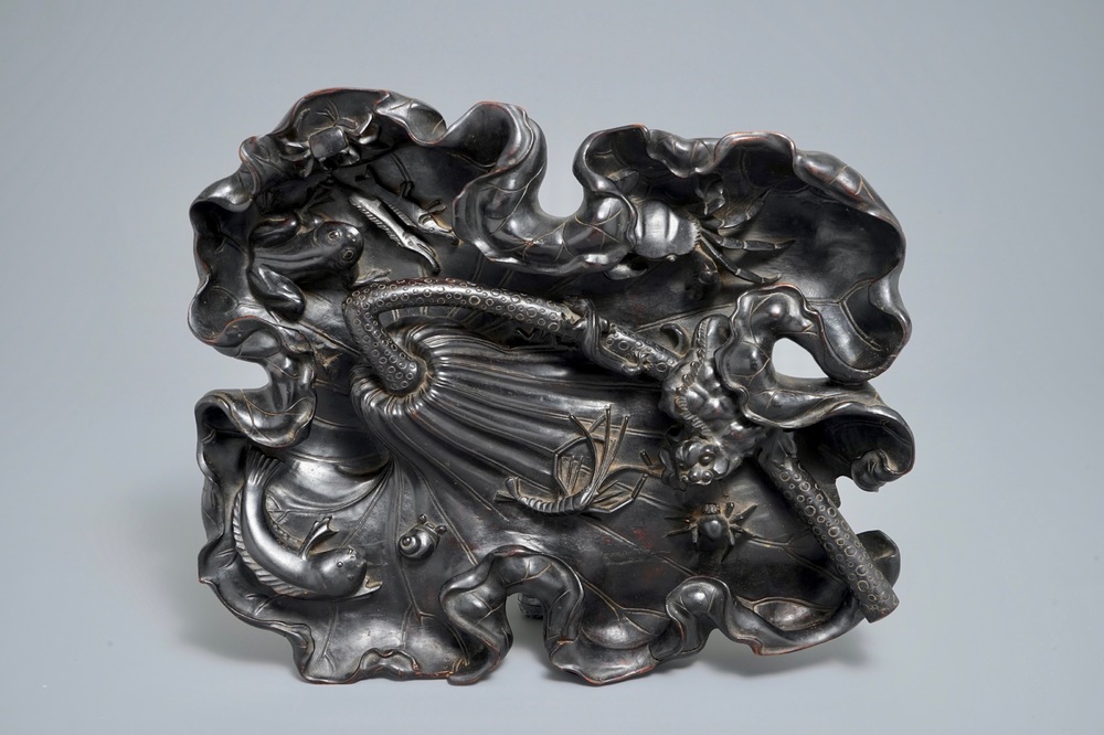 A large Chinese carved wood lotus leaf with various water animals, 19th C.