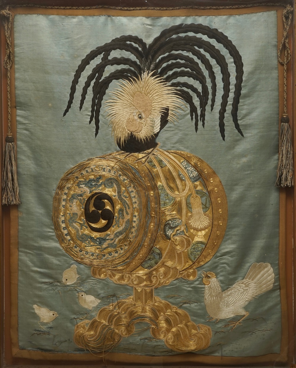 A Japanese silk embroidery depicting a rooster on an o-daiko drum, Edo or Meiji, 19th C.