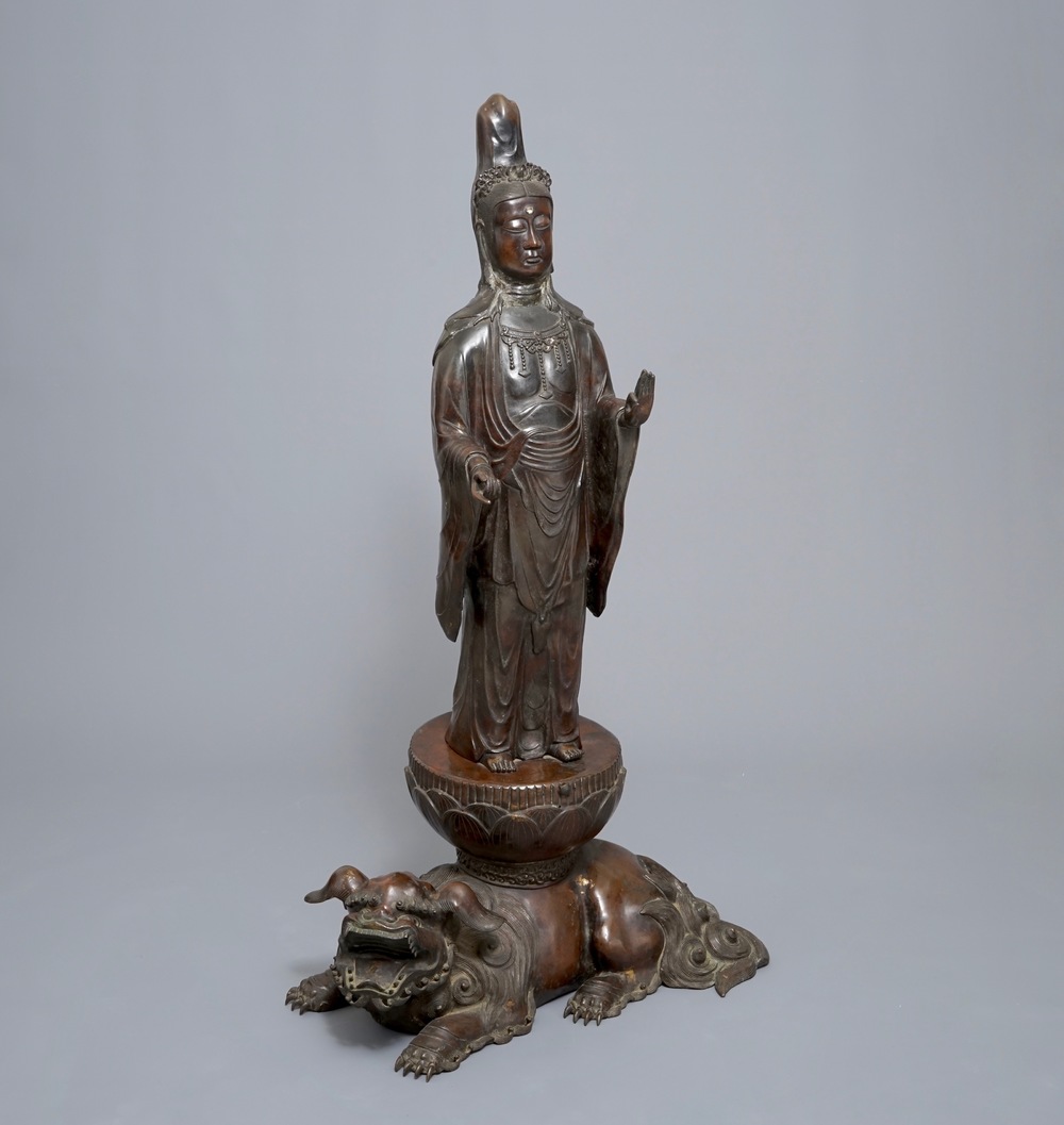 A large Japanese bronze group of Kannon on a Shi-shi, Meiji, 19th C.