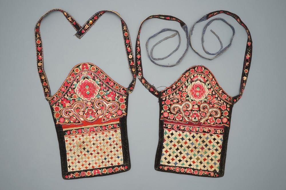 A pair of Chinese embroidered baby carriers, Miao minority, Southern China, early 20th C.