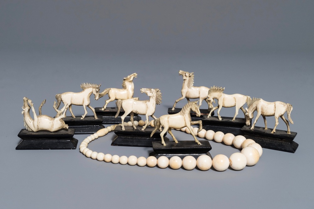 Eight Chinese carved ivory horses on stands and a necklace, 19/20th C.