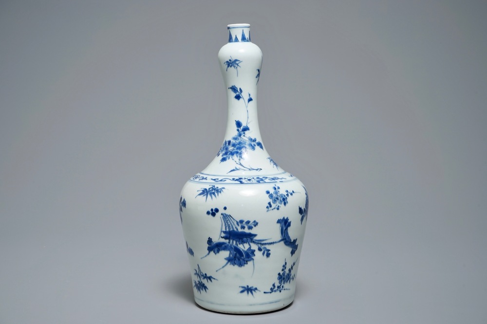 A Chinese blue and white bottle vase with floral design, Transitional period