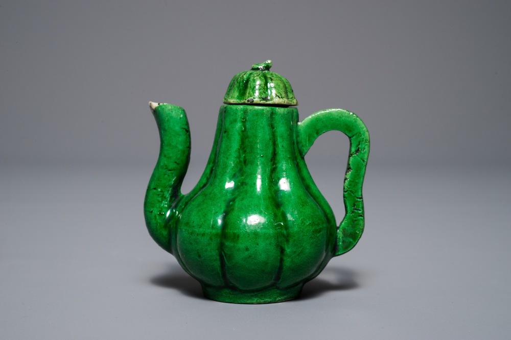 A small Chinese verte biscuit 'chrysanthemum' teapot and cover, Kangxi