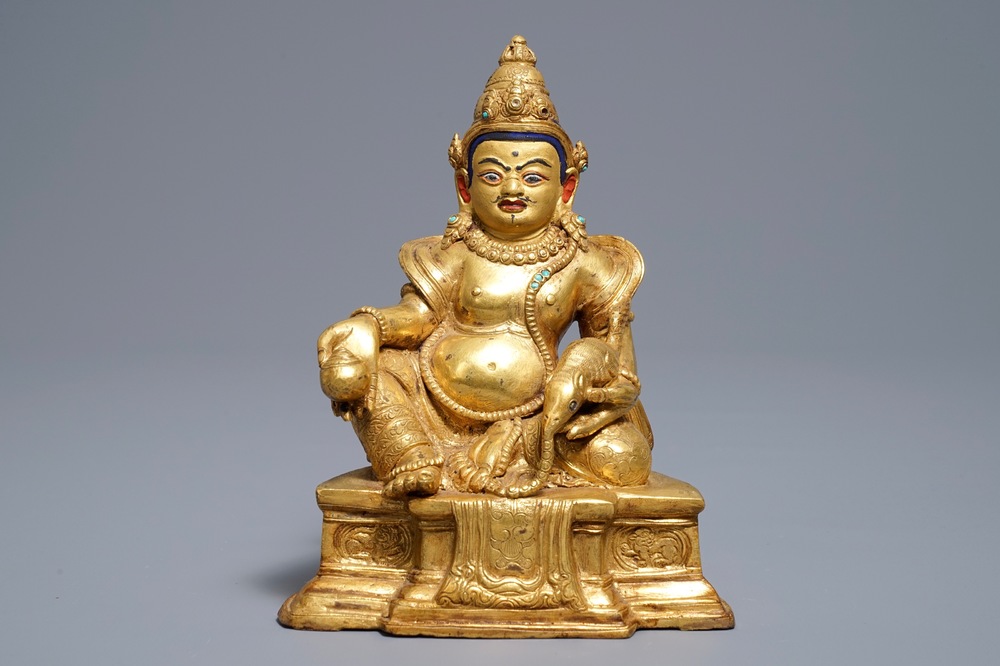 A Sino-Tibetan gilt bronze figure of Jambhala, 19/20th C.