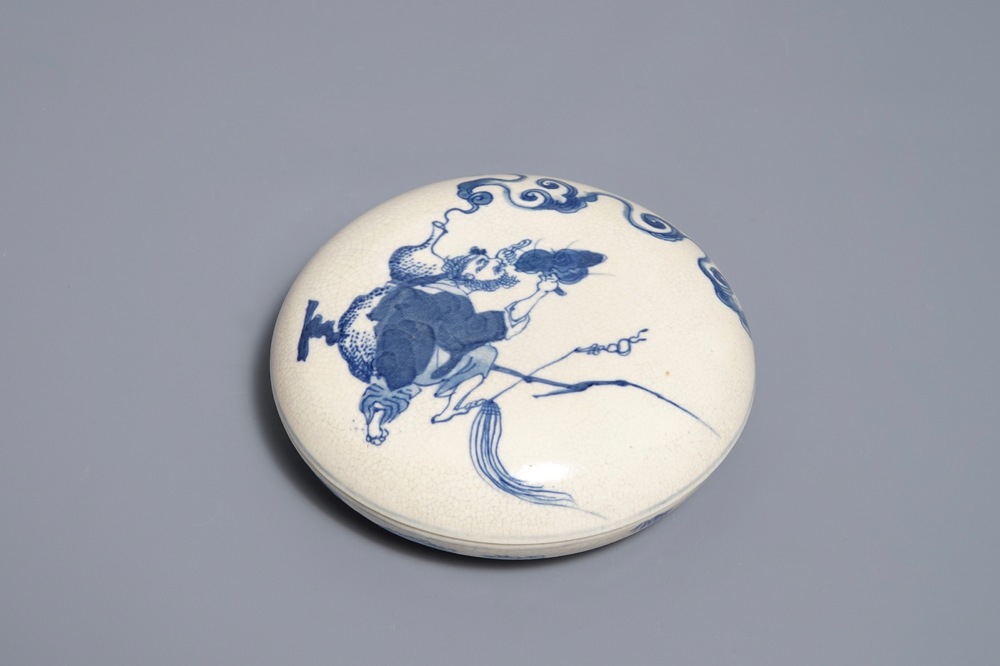 A Chinese blue and white seal paste box with the Immortal Li Tieguai, Kangxi mark, 19th. C.