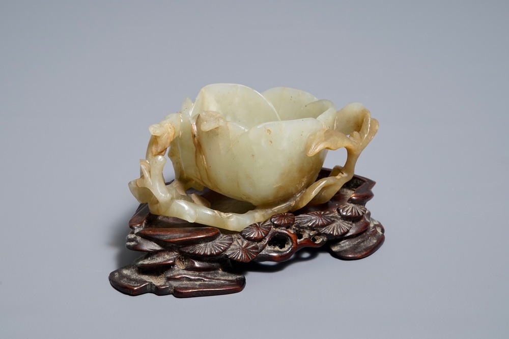 A Chinese lotus-shaped jade libation cup on stand, 18/19th C.