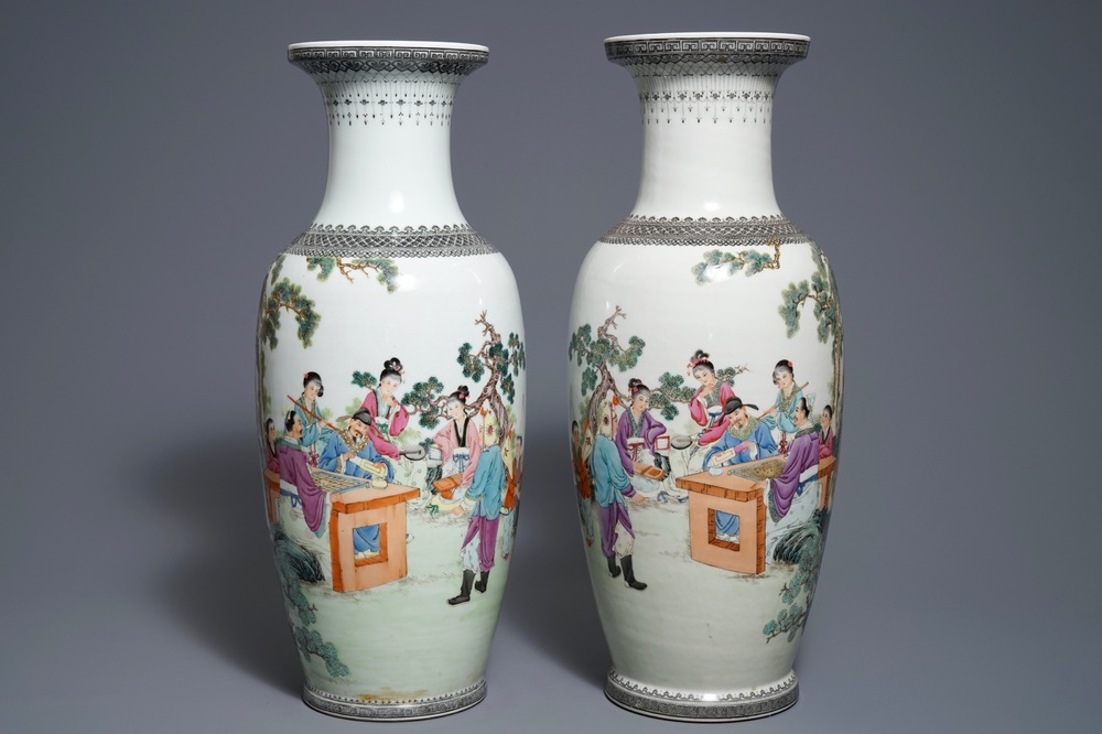 A pair of Chinese famille rose vases with figures in a garden, Qianlong mark, 20th C.