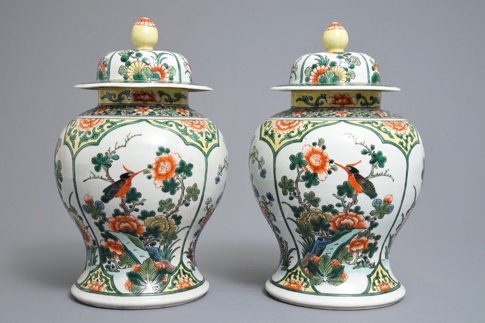 A pair of Chinese famille verte vases and covers with birds and flowers, 19th C.